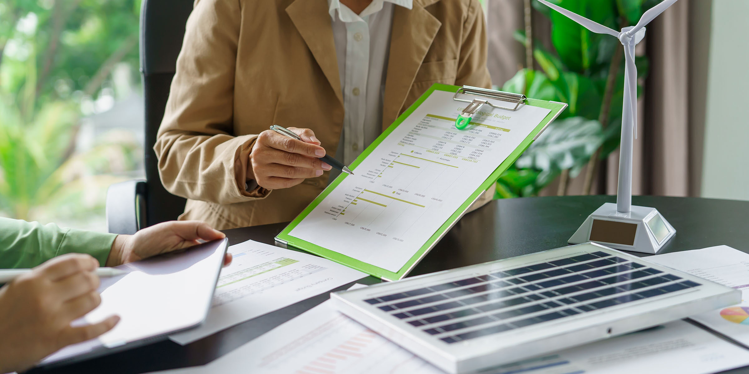 Solar panels green energy Business people working in green eco friendly office business meeting creative ideas for business eco friendly professional teaching corporate people sustainable electricity